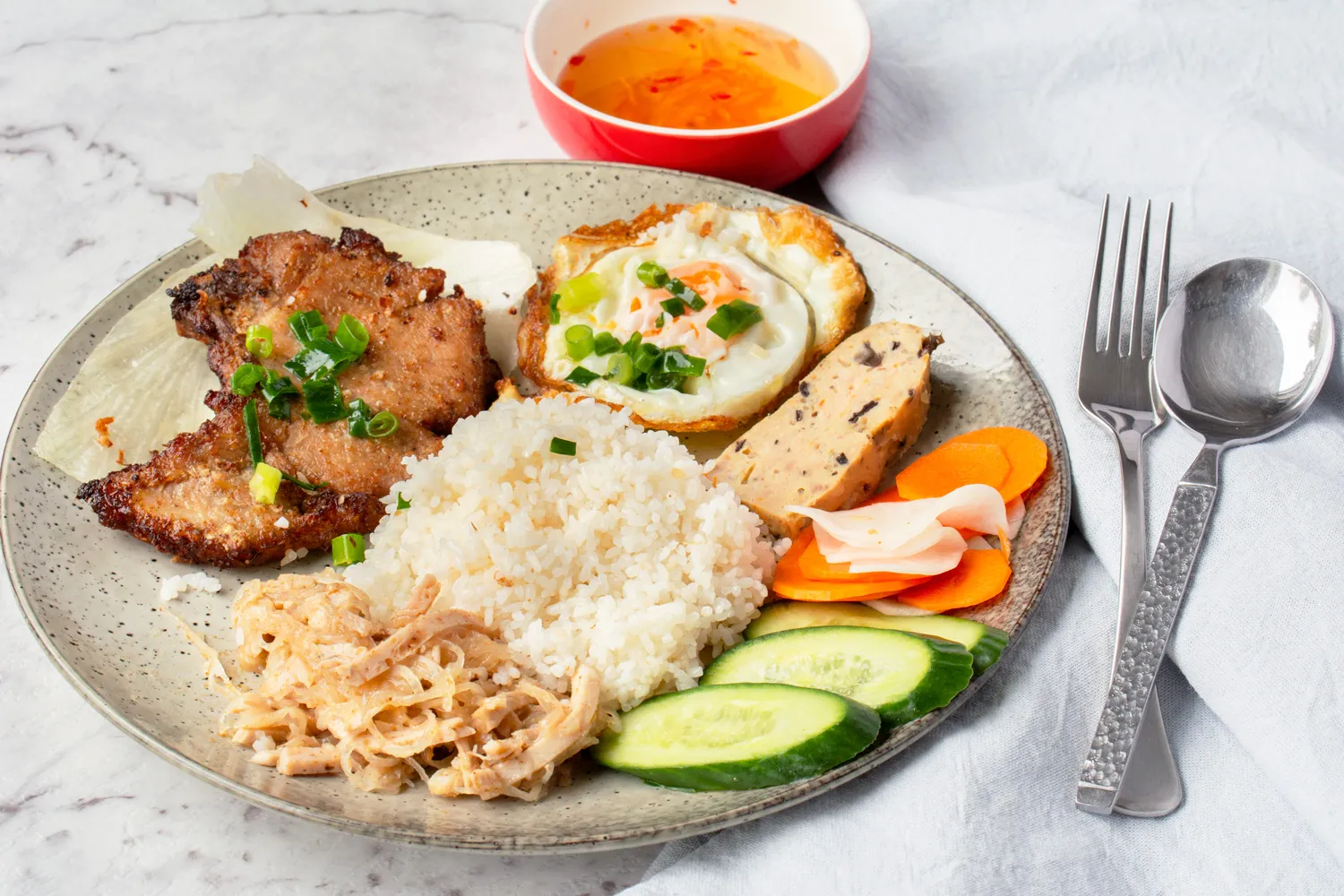 Grilled lemongrass pork chop with a fried egg over rice — a $12.95 weekly lunch special at Thien Vietnam in Thornhill
